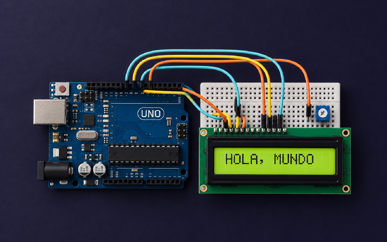 An Arduino Uno wired to a breadboard and a 16×2 LCD screen that reads “HOLA, MUNDO”.